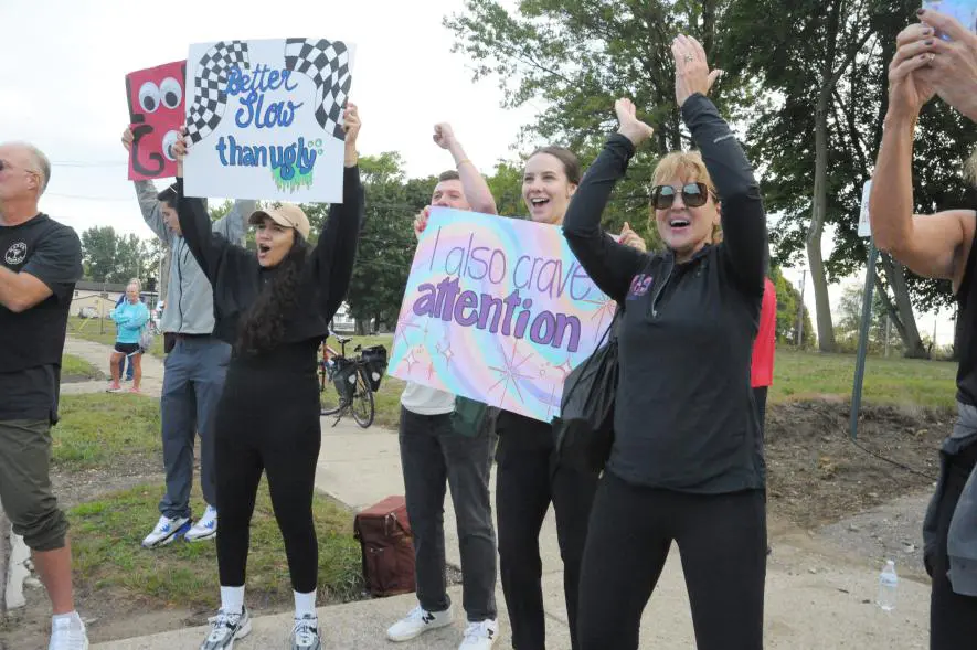 Community cheering for their friends and families